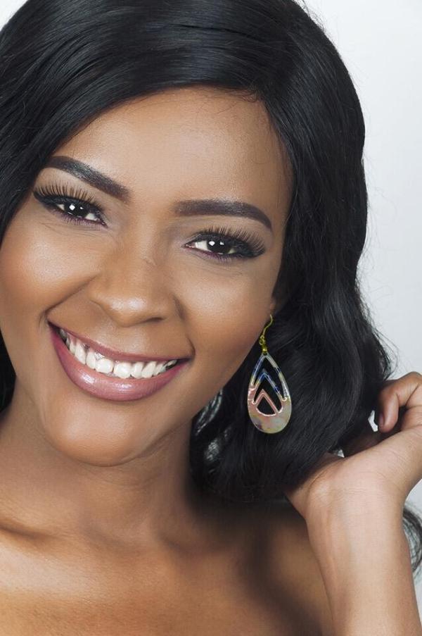 multi-color teardrop earrings on a dark complexion woman