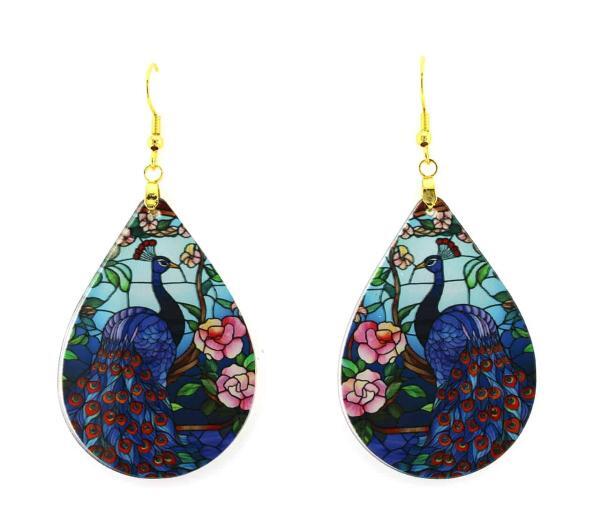 exotic peacock earrings in vibrant blue with pink flowers in an Asian garden