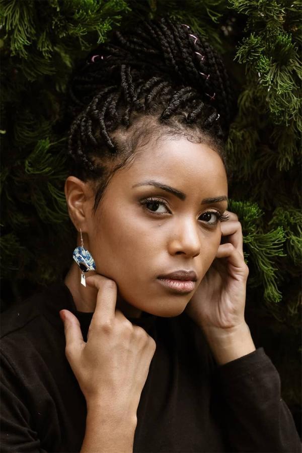 beautiful dark woman with great wave tassel earrings