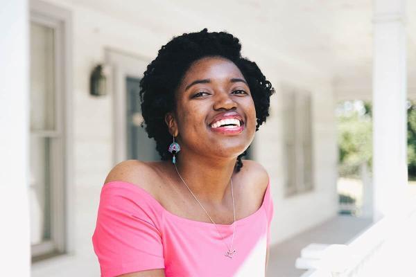 pretty black woman wearing tranquil aqua fan shaped earrings